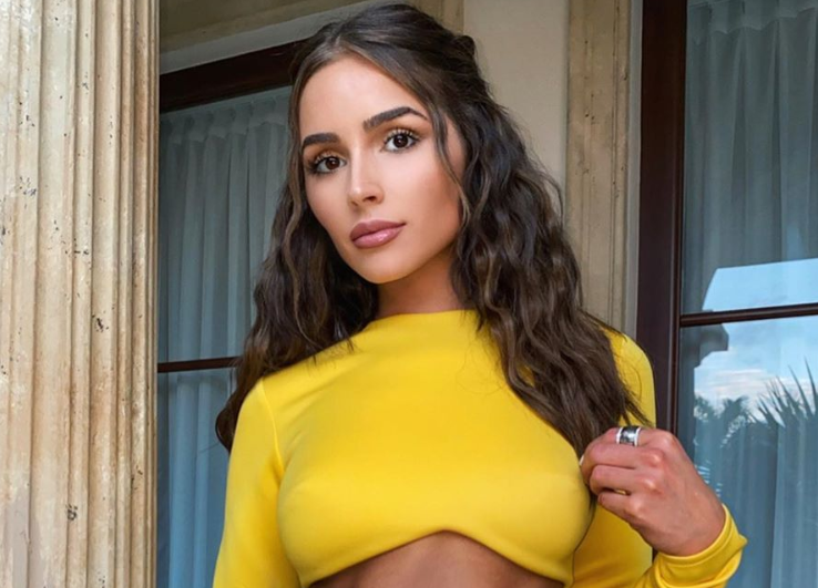 Olivia Culpo sizzles in a yellow crop top and jeweled skirt